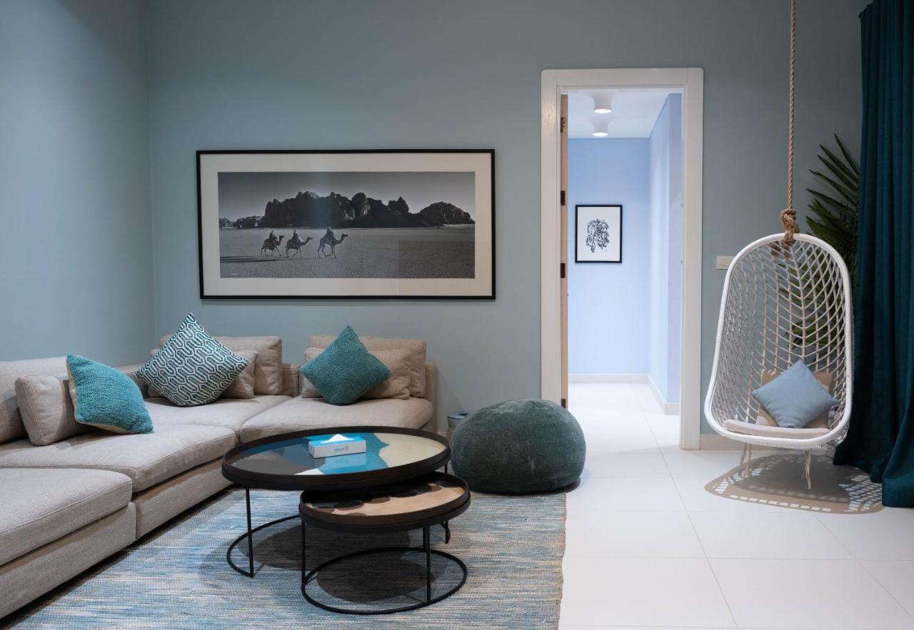 Cloud 7 Residences Ayla Aqaba Exterior photo A living room with a swing chair